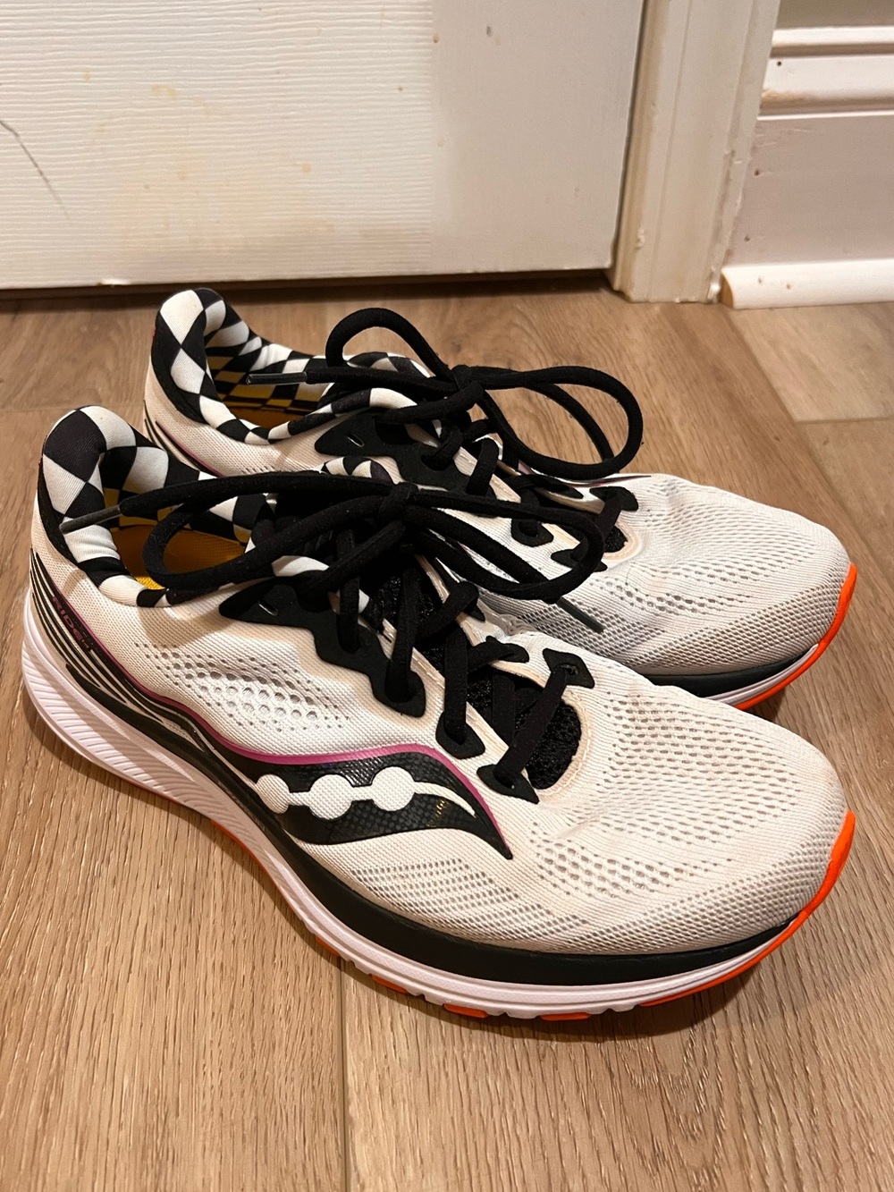 Saucony Women’s Reverie White Athletic Running Shoe with Black & Pink Accents